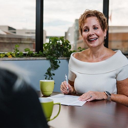 Sheri Welsh meeting with a client