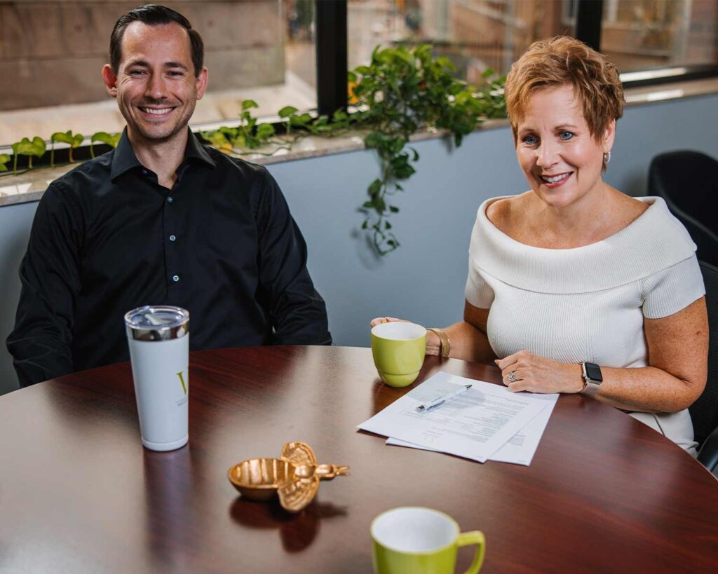 Sheri Welsh and Spencer Welsh in a meeting with client