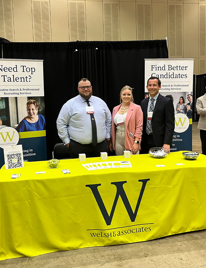 Alisha Welsh and team at a Welsh & Associates booth