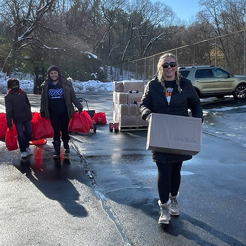 Alisha Welsh carrying food for a charity event