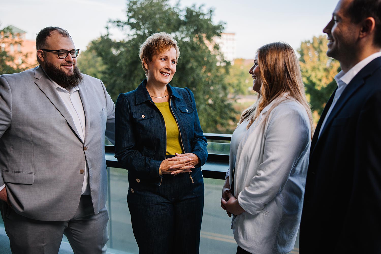 Welsh team conversing and smiling.